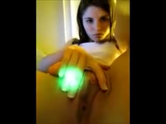 This gorgeous dark-brown sexpot uses her webcam to play with her cat.